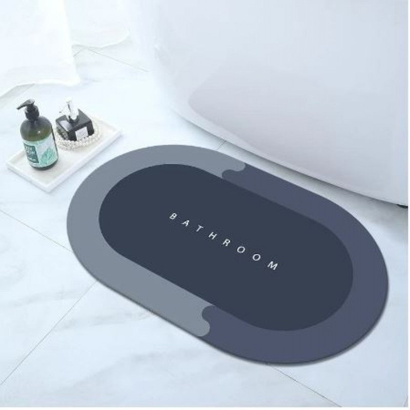 Gray bath mat with 'Bathroom' text on a white floor