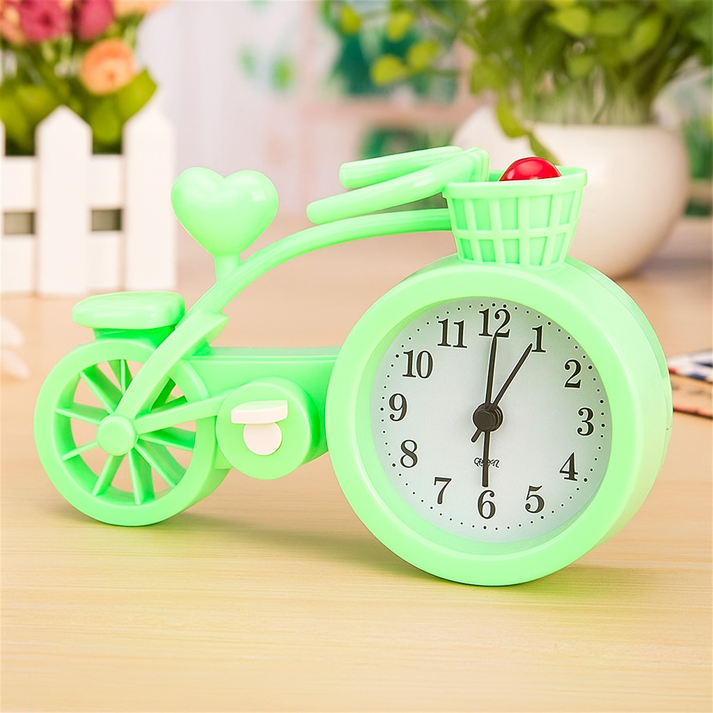 Green bicycle-shaped clock on a wooden surface with a blurred background