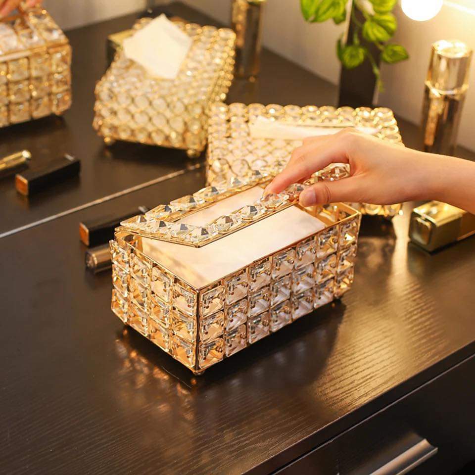 Luxury crystal tissue box on a dark surface, showcasing its elegant design and practicality.