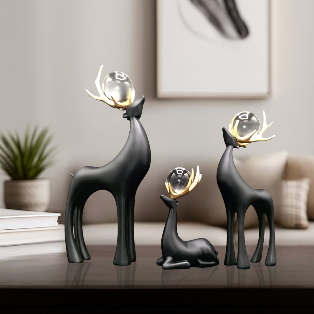 Artistic deer decor set featuring elegant deer sculptures with glass orbs, perfect for enhancing any living space.