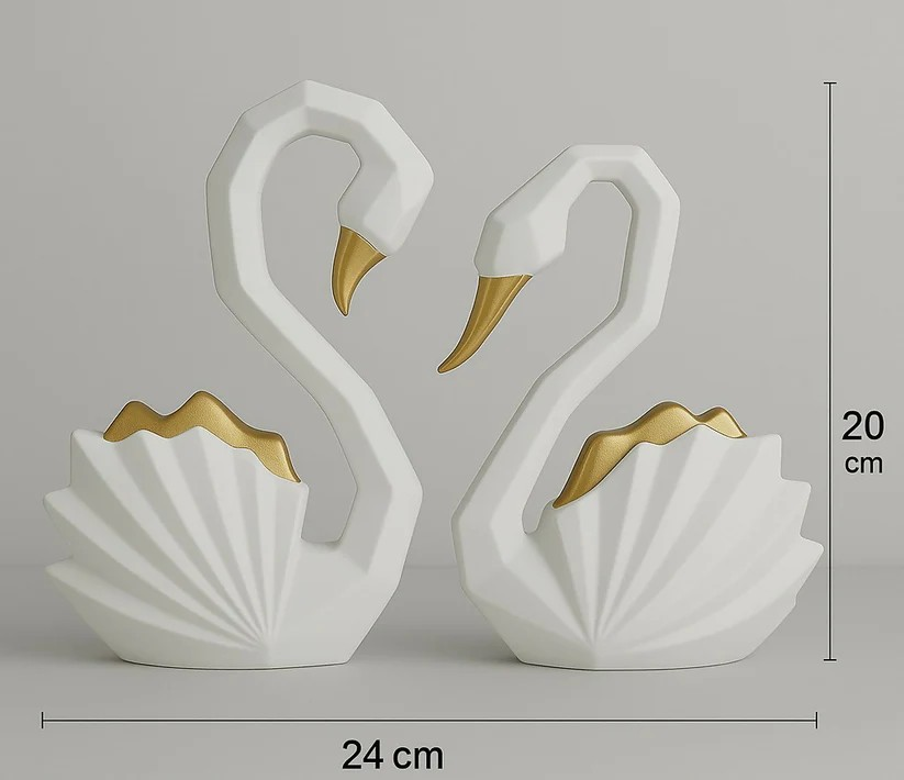 Two white swan figurines with gold accents on a gray background, accompanied by measurements.