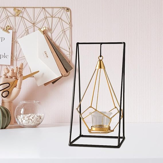 Geometric candle holder with gold accents on a white surface