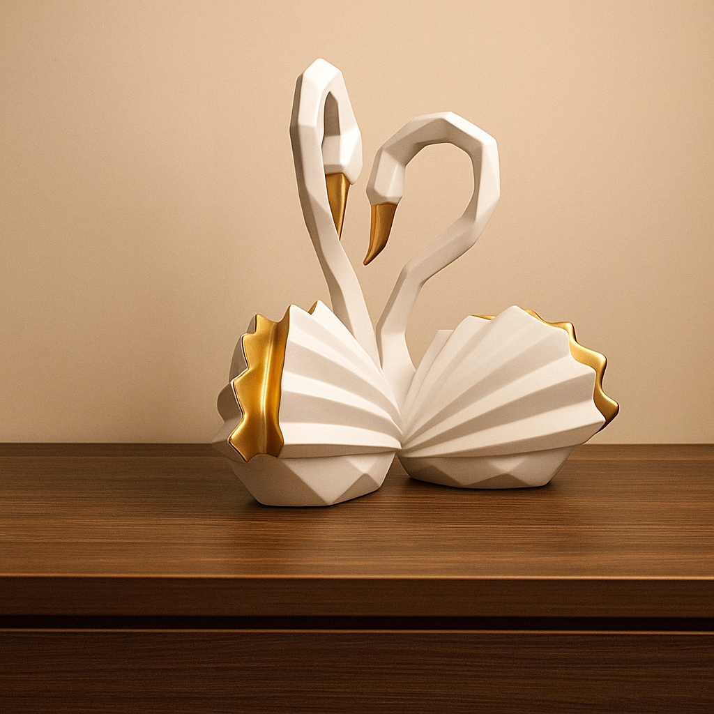 Decorative swan figurines with gold accents on a wooden surface against a beige background