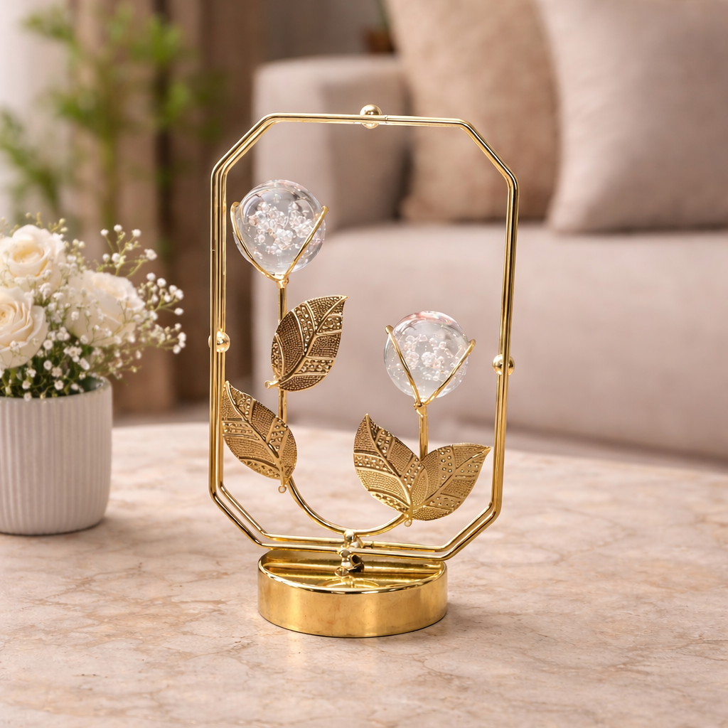 Decorative gold lamp with crystal flowers on a marble surface in a living room setting.