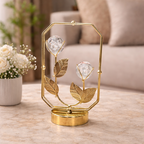 Decorative gold lamp with crystal flowers on a marble surface in a living room setting.