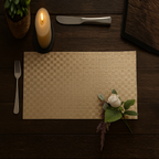Placemat with a white rose, candle, knife, and fork on a wooden table