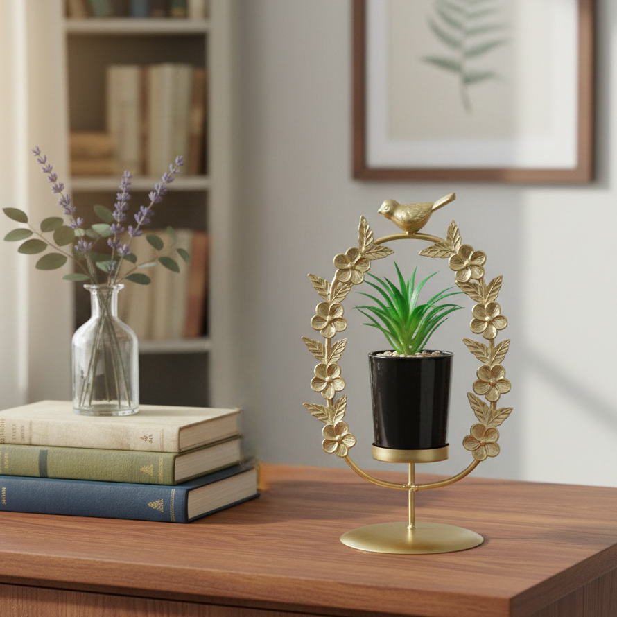 Decorative plant holder with a small potted plant on a wooden surface, with books and a vase in the background.