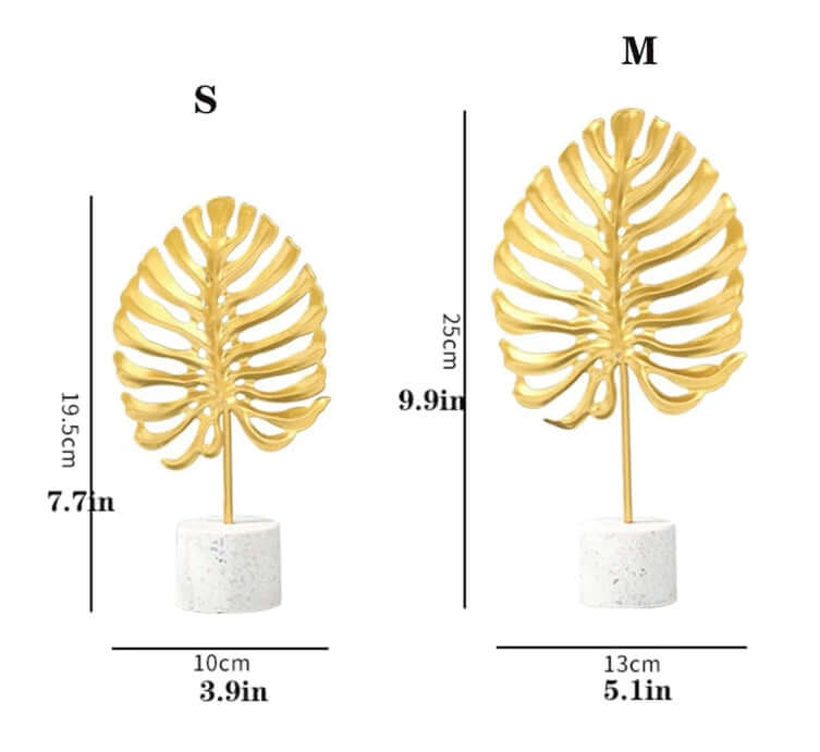 Gold leaf monstera leaf decor in small and medium sizes, showcased on a white base, perfect for home decor accents.