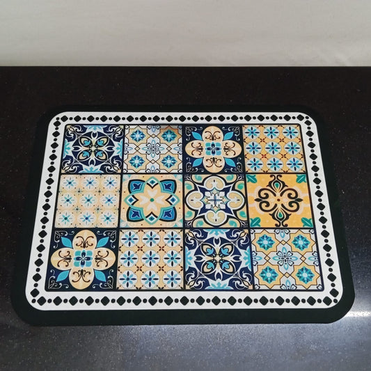 Decorative placemat with geometric pattern on a black surface