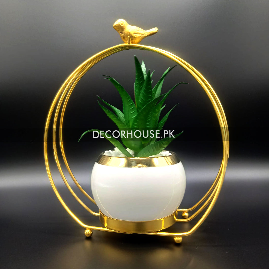 Metal geometric frame with bird and plant